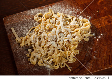 Fresh pasta on board 23430801