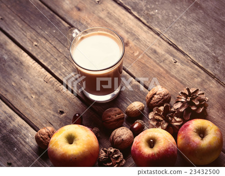 apples, fir-cones, cup of coffee and nuts apples, fir-cones, cup of coffee and nuts 23432500