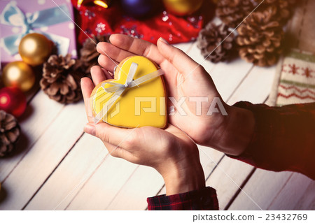 female hands holding a cookie 23432769