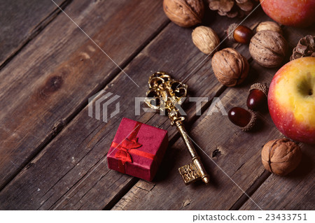 apples, fir-cones, gift, key and nuts apples, fir-cones, gift, key and nuts 23433751
