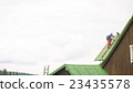 Man Working on the Roof, Sandering Paint 23435578