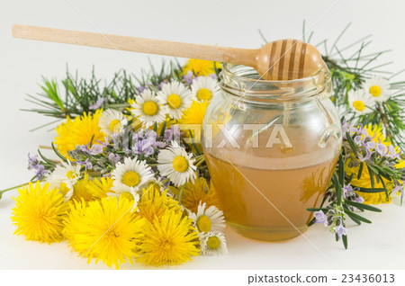 Fresh flowers and a jar of honey 23436013