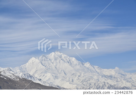 Pakistan Hunza's famous peaks Rakaposhi peak and blue skies and thin clouds 23442876