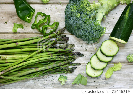 raw green vegetables on a rustic white table 23446219