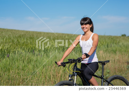 Mountain biking happy sportive girl relax in 23446369