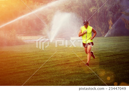 Healthy athlete performs physical exercises Healthy athlete performs physical exercises 23447049