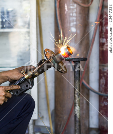 Welders were repairing Shock absorbers Welders were repairing Shock absorbers 23447338