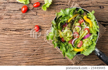 fresh vegetable salad on old wooden background 23449445
