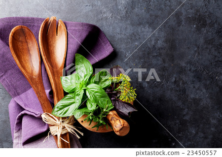 Fresh garden herbs in mortar 23450557