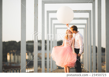 Lovers man and woman embracing each other outdoors 23450723