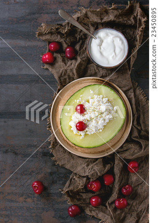 Cottage cheese in melon Cottage cheese in melon 23450895