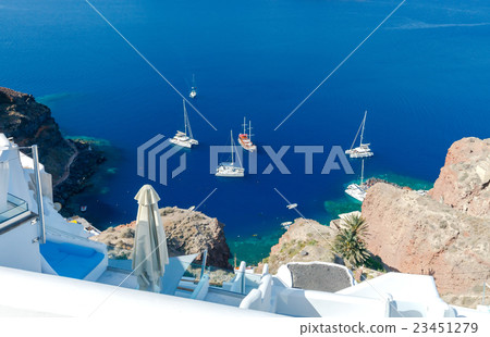 The old fishing harbor in the village Oia. The old fishing harbor in the village Oia. 23451279