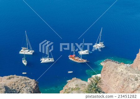 The old fishing harbor in the village Oia. The old fishing harbor in the village Oia. 23451282