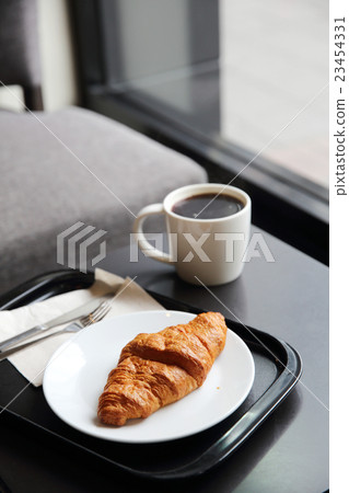 croissant and coffee in coffee shop croissant and coffee in coffee shop 23454331
