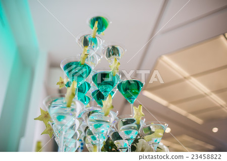 the pyramid of glasses with champagne and a the pyramid of glasses with champagne and a 23458822