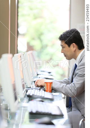 Businessman internet cafe image 23459493