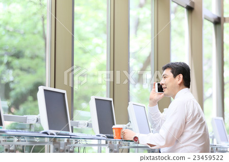 Businessman internet cafe image 23459522