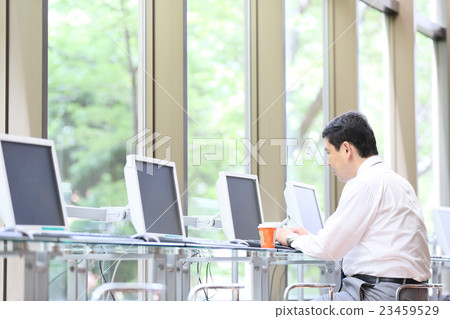 Businessman internet cafe image 23459529