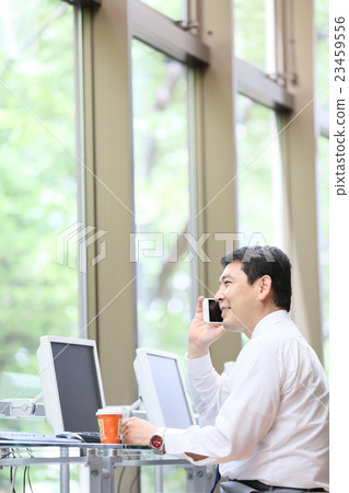 Businessman internet cafe image 23459556