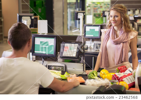 Woman buying food at supermarket Woman buying food at supermarket 23462568