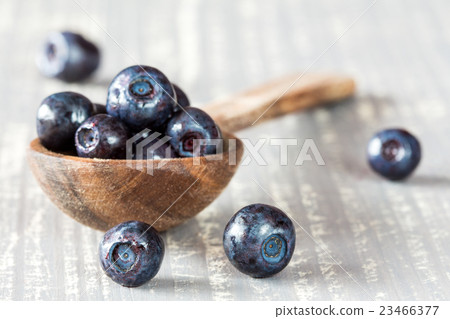 Blueberries on a wooden spoon 23466377