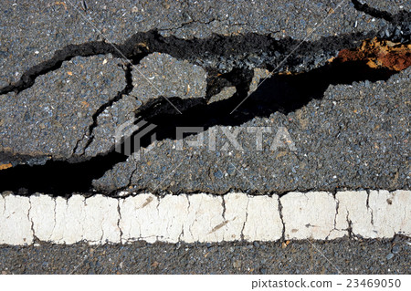 Fissures and erosion of the asphalt road Fissures and erosion of the asphalt road 23469050