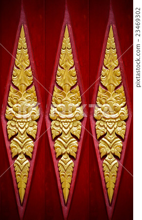 Wood carving in native Thai style. Wood carving in native Thai style. 23469302