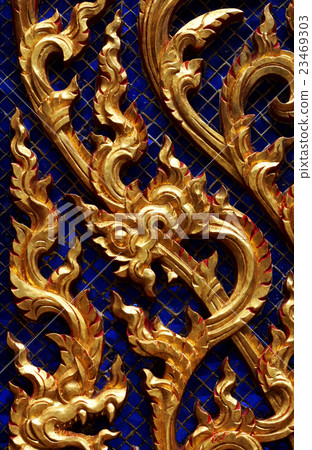 Wood carving in native Thai style. 23469303