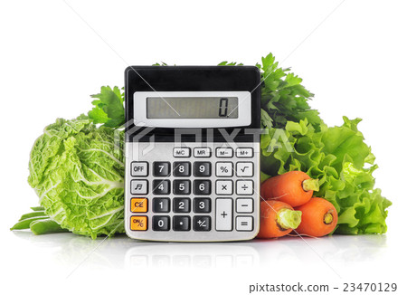 Green vegetables, calculator isolated on a white Green vegetables, calculator isolated on a white 23470129