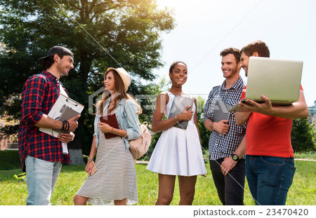 Modern youth relaxing outdoors 23470420