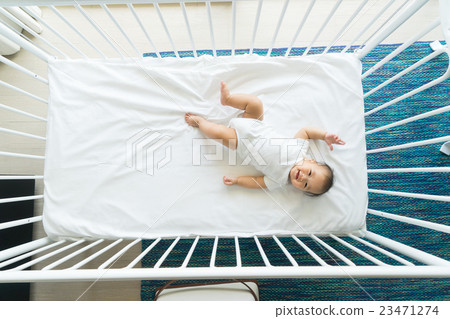 the top view of baby in cot, cradle 23471274