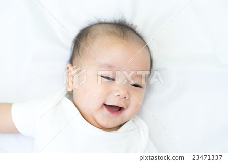 Portrait of a newborn Asian baby on the bed 23471337