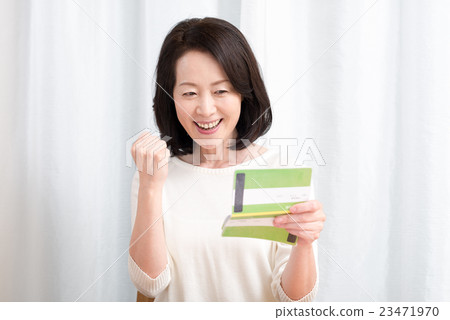 Housewife with passbook Housewife with passbook 23471970