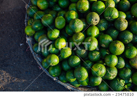 Basket with fresh limes Basket with fresh limes 23475810