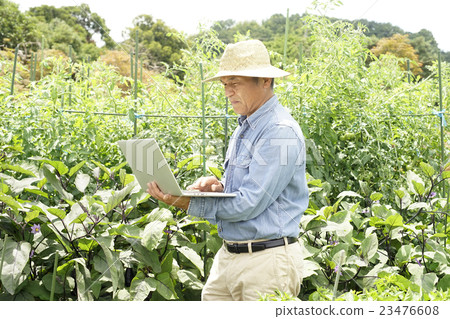 Farmer with a personal computer Farmer with a personal computer 23476608