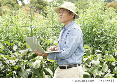 Farmer with a personal computer Farmer with a personal computer 23476611