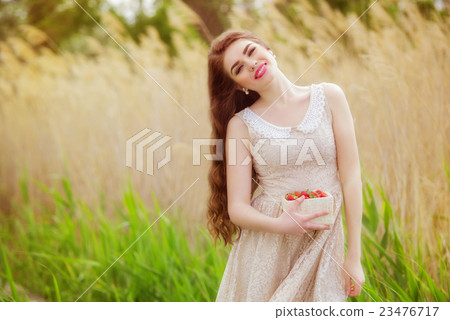 Girl with long hair in water in summer  23476717