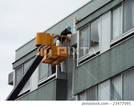 Air conditioner repair on higher floors is a crane car Air conditioner repair on higher floors is a crane car 23477095