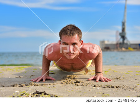 yoga man in a dog pose yoga man in a dog pose 23481450