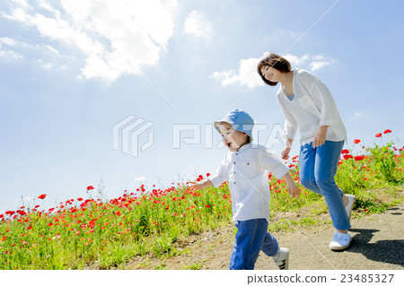 Mother and child running in a fresh green park Mother and child running in a fresh green park 23485327
