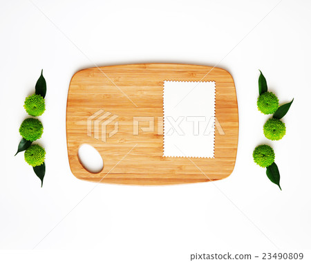 Wooden cutting board and paper with decoration. Wooden cutting board and paper with decoration. 23490809