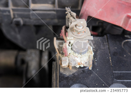 Car battery corrosion on terminal. 23495773