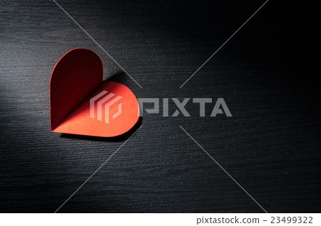 Red hearts on black wooden background. 23499322