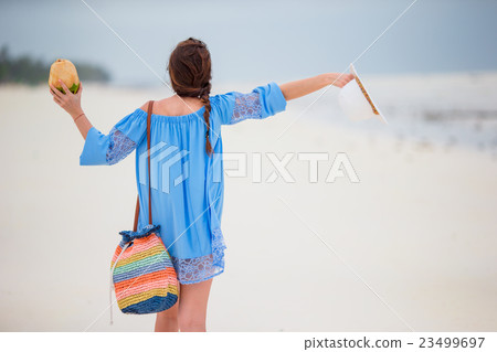 Young beautiful girl on beach vacation 23499697