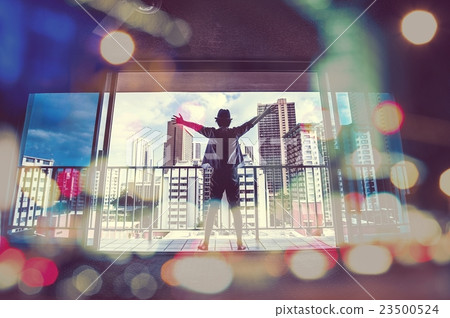 A man spreading his hand toward the window 23500524