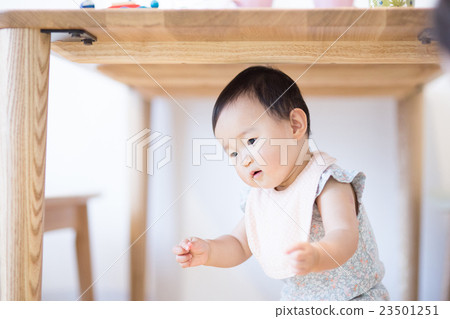 Baby under the table 23501251