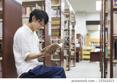 Reading at the library 23502823