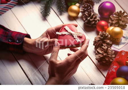 female hands holding a cookie female hands holding a cookie 23505018
