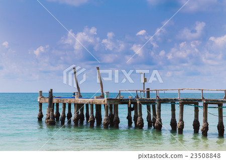 Wooden pier leading to sea 23508848