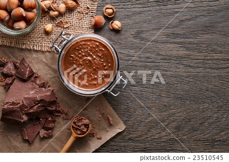Background with hazelnut spread and ingredients Background with hazelnut spread and ingredients 23510545
